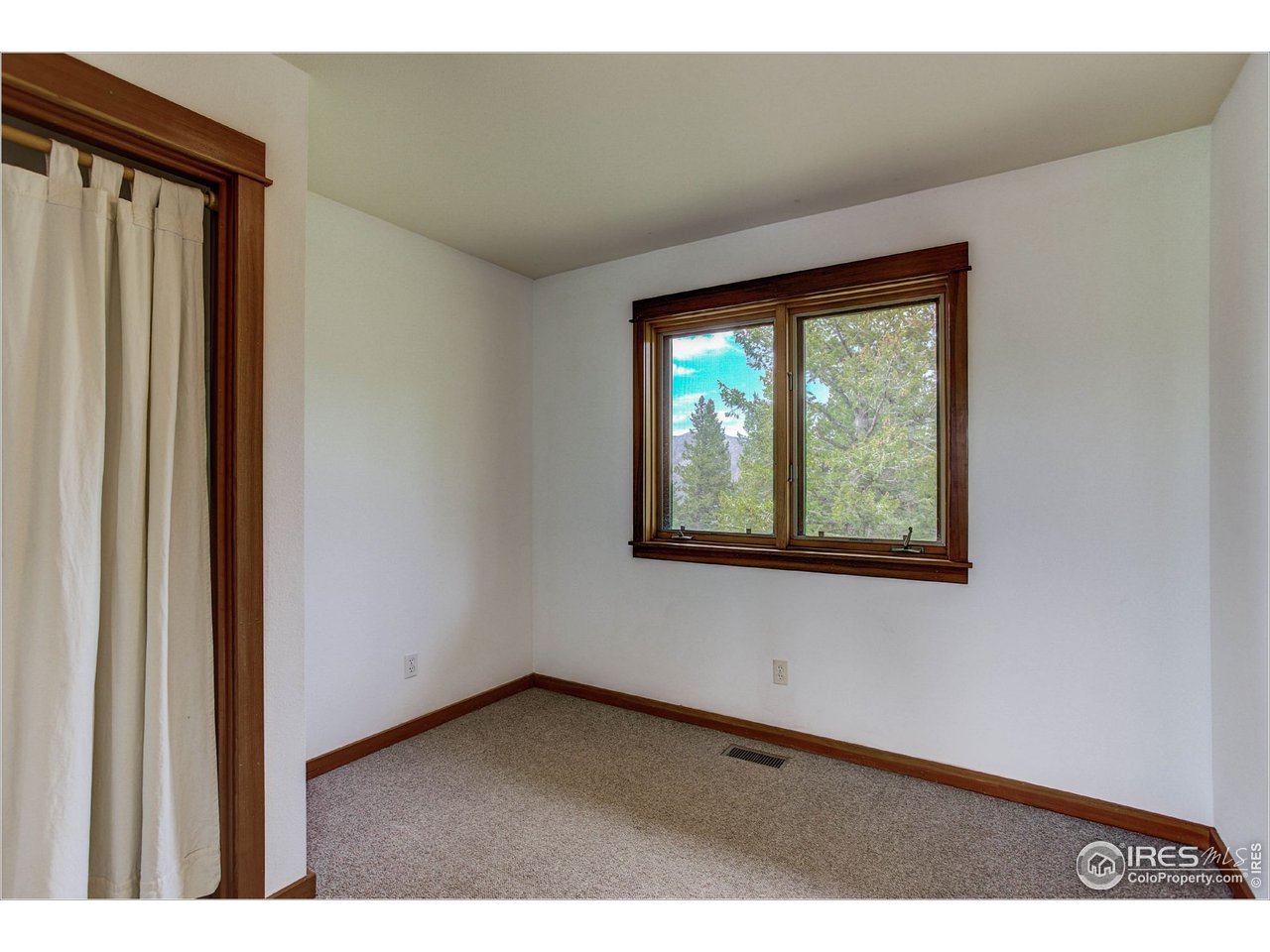 595 Left Fork Road Boulder, CO 80302 - Photo 3 of 19 a view of an empty room with a window