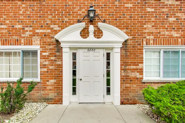 a front view of a building with a entrance