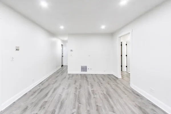 a kitchen with stainless steel appliances a refrigerator sink and microwave