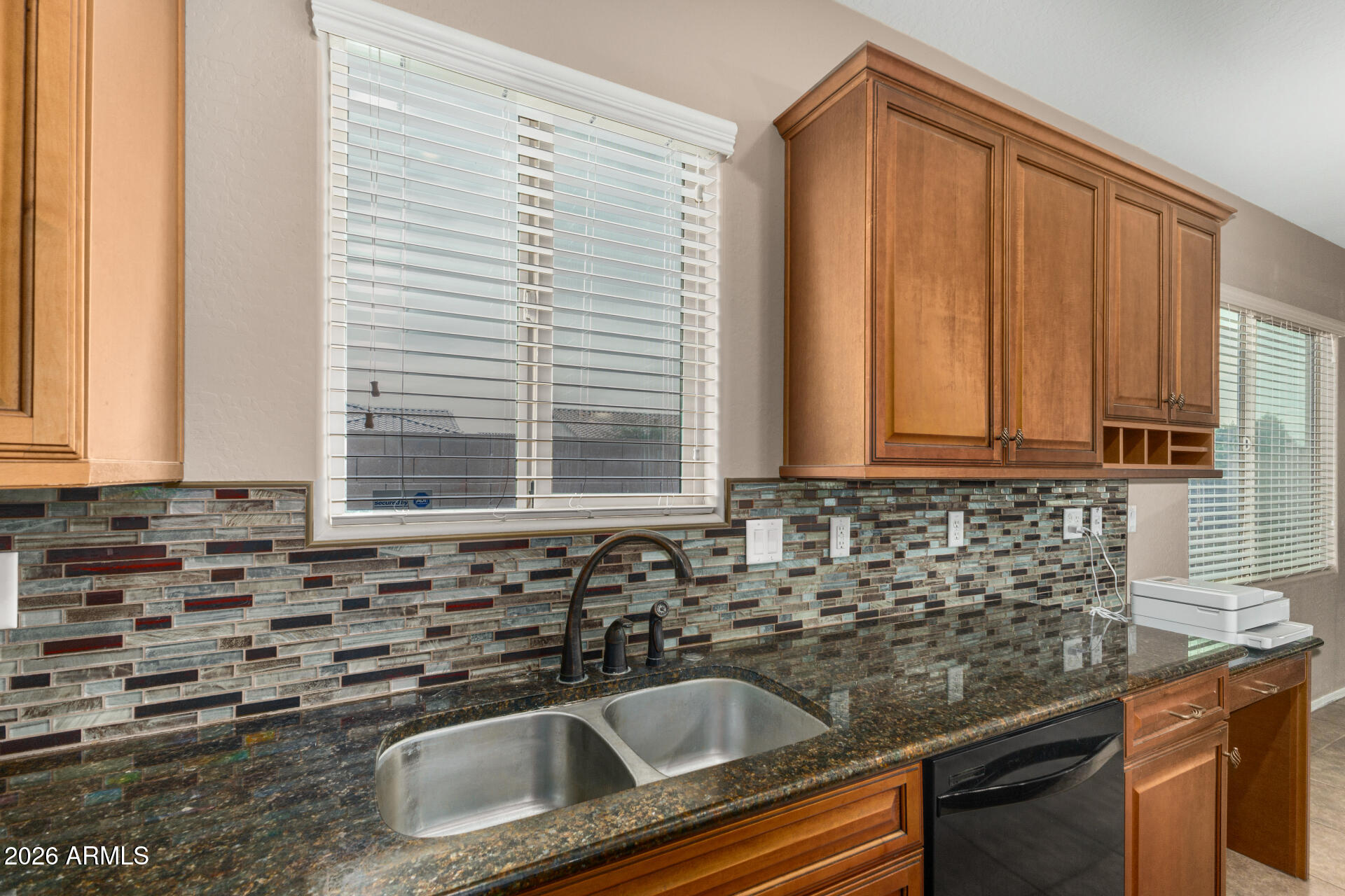 5718 West Pecan Road Laveen, AZ 85339 - Photo 14 of 37 a kitchen with a sink and cabinets