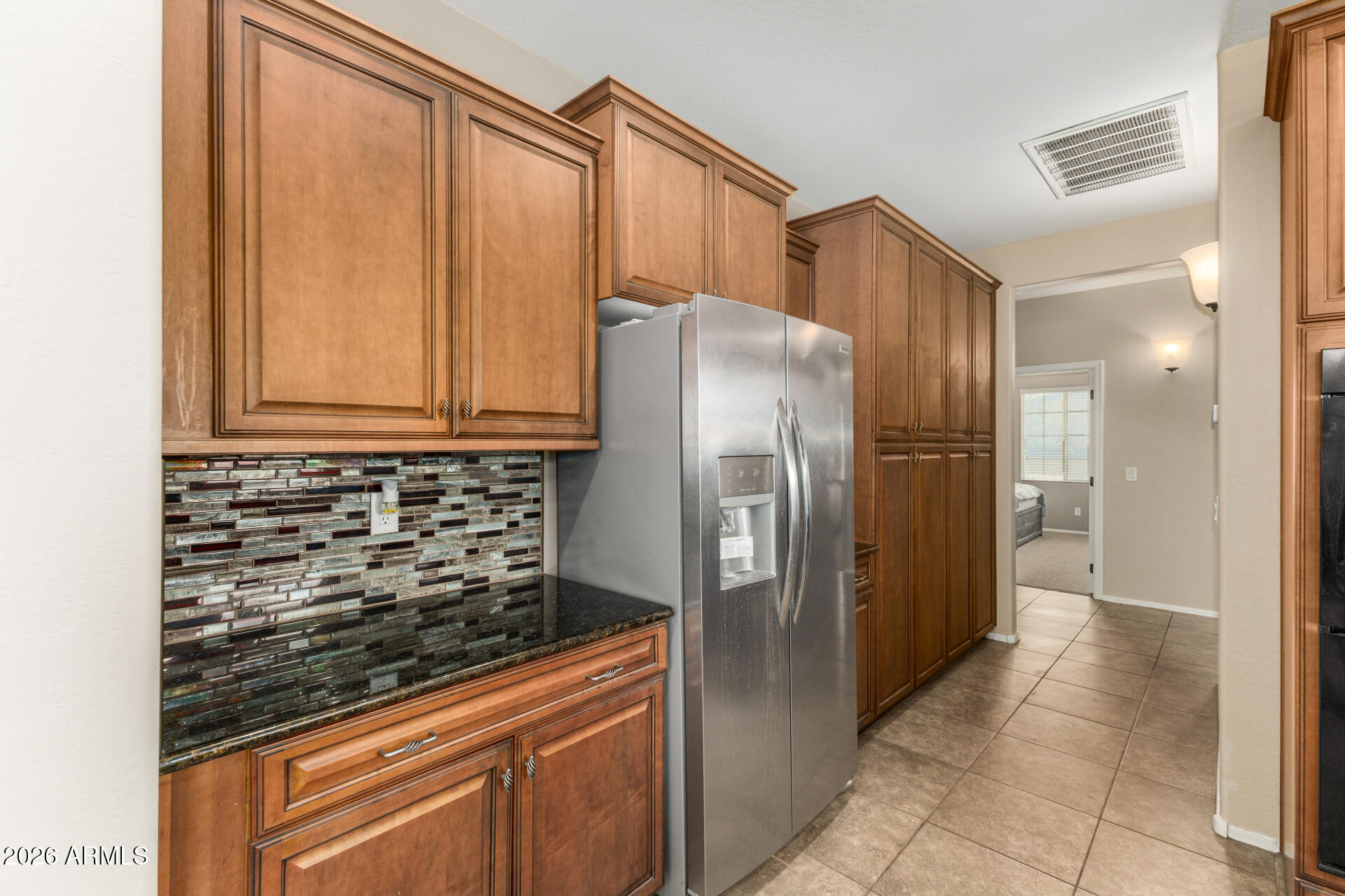 5718 West Pecan Road Laveen, AZ 85339 - Photo 15 of 37 a kitchen with stainless steel appliances granite countertop a refrigerator and a sink