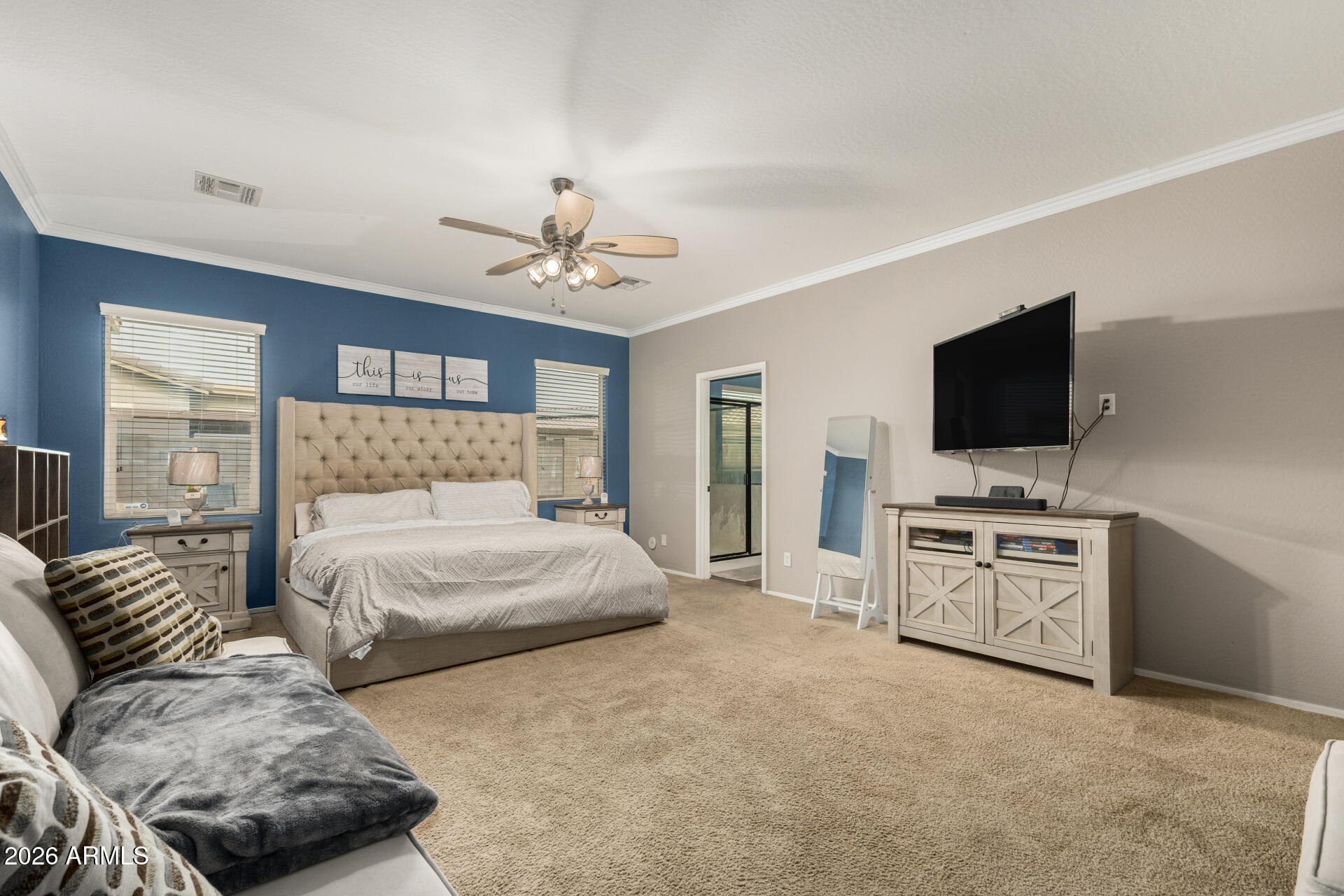 5718 West Pecan Road Laveen, AZ 85339 - Photo 17 of 37 a bedroom with furniture and a flat screen tv