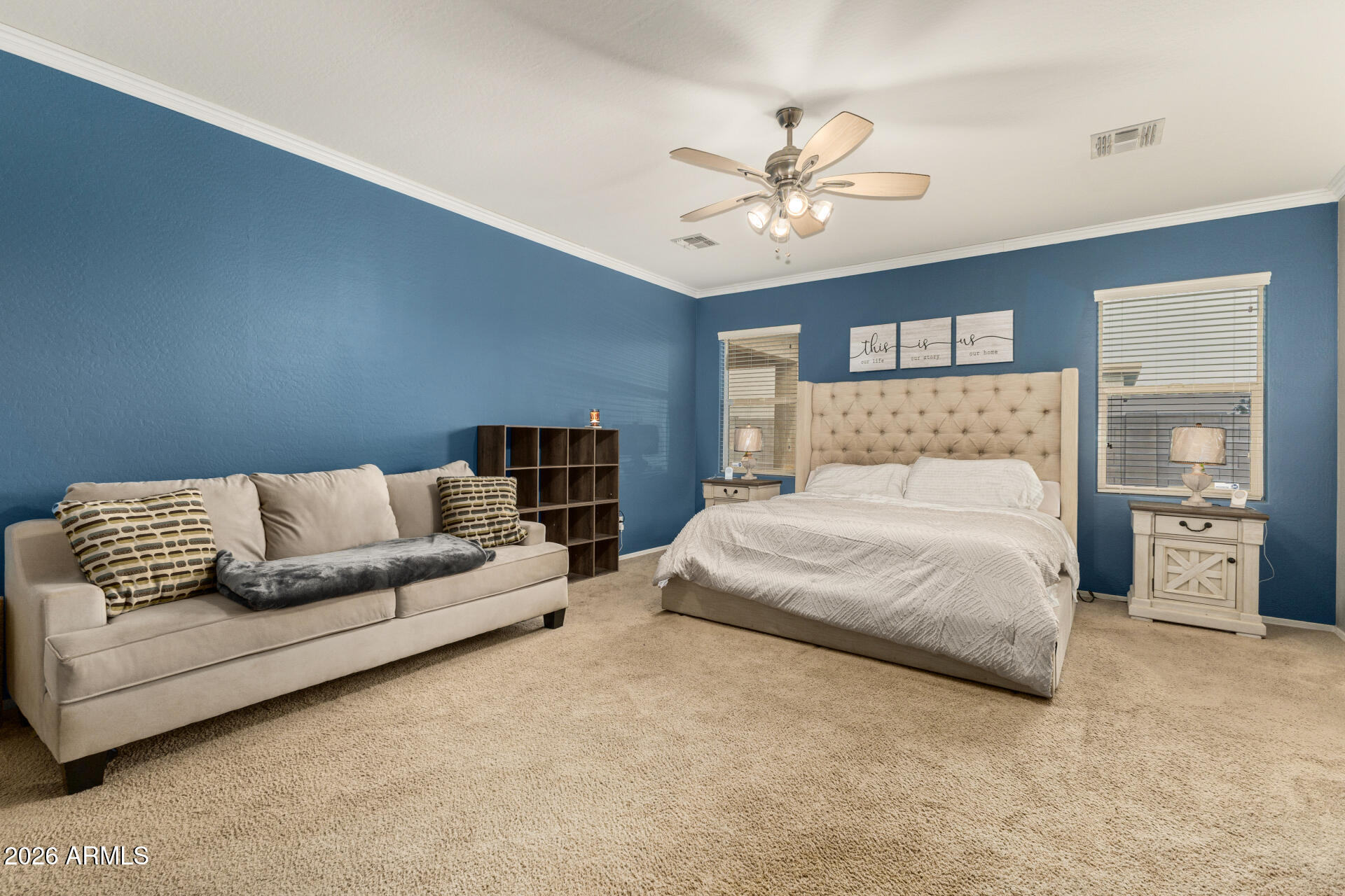 5718 West Pecan Road Laveen, AZ 85339 - Photo 18 of 37 a bedroom with a large bed and ceiling fan