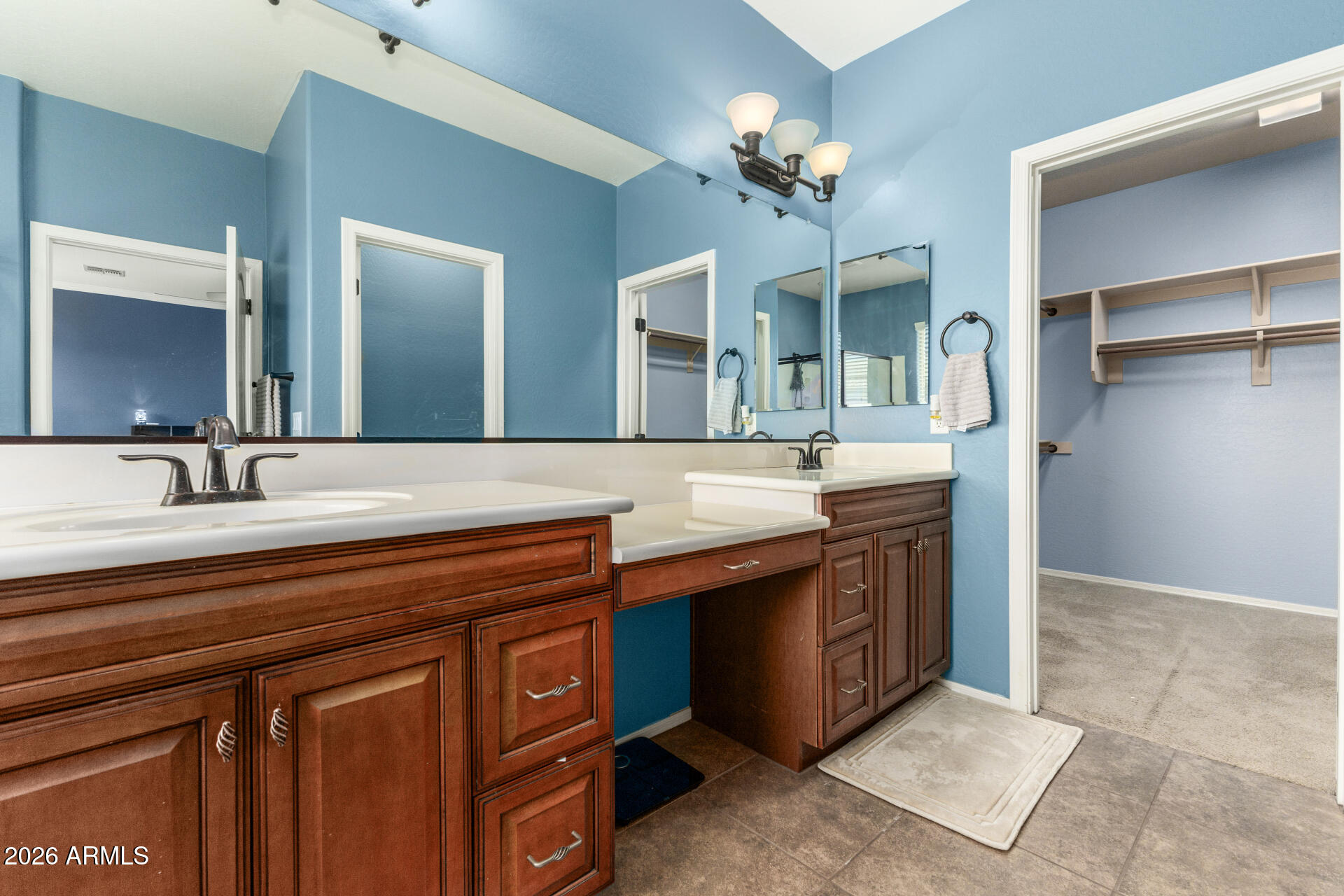 5718 West Pecan Road Laveen, AZ 85339 - Photo 20 of 37 a bathroom with a sink and a mirror