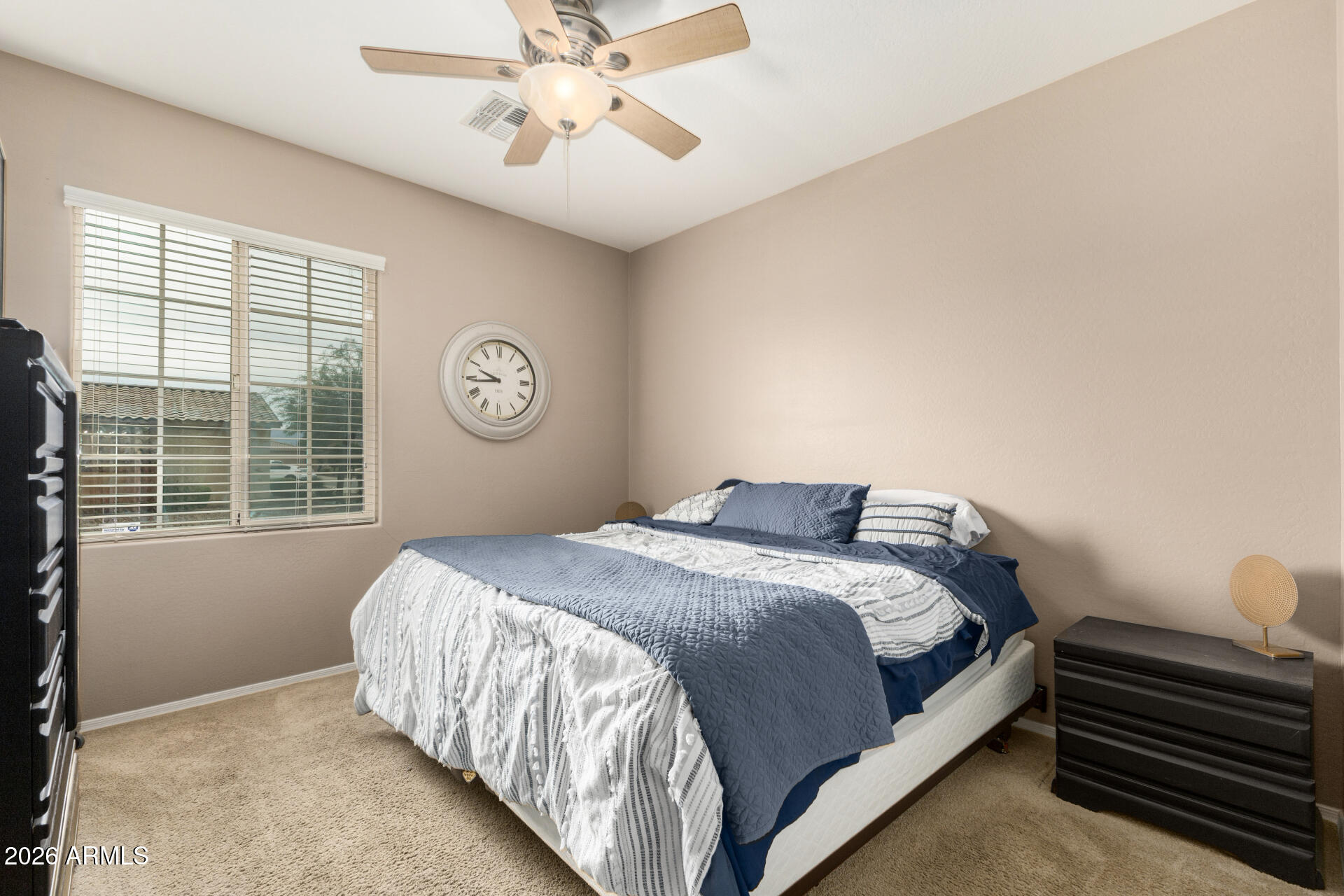 5718 West Pecan Road Laveen, AZ 85339 - Photo 26 of 37 a bedroom with a bed and a window