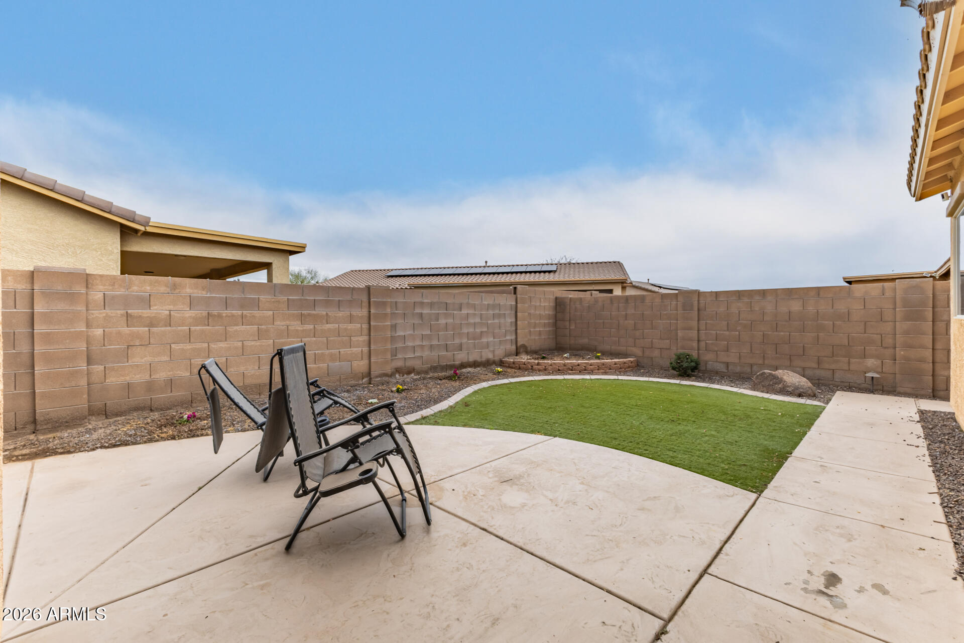 5718 West Pecan Road Laveen, AZ 85339 - Photo 32 of 37 a view of a patio with a table and chairs under an umbrella
