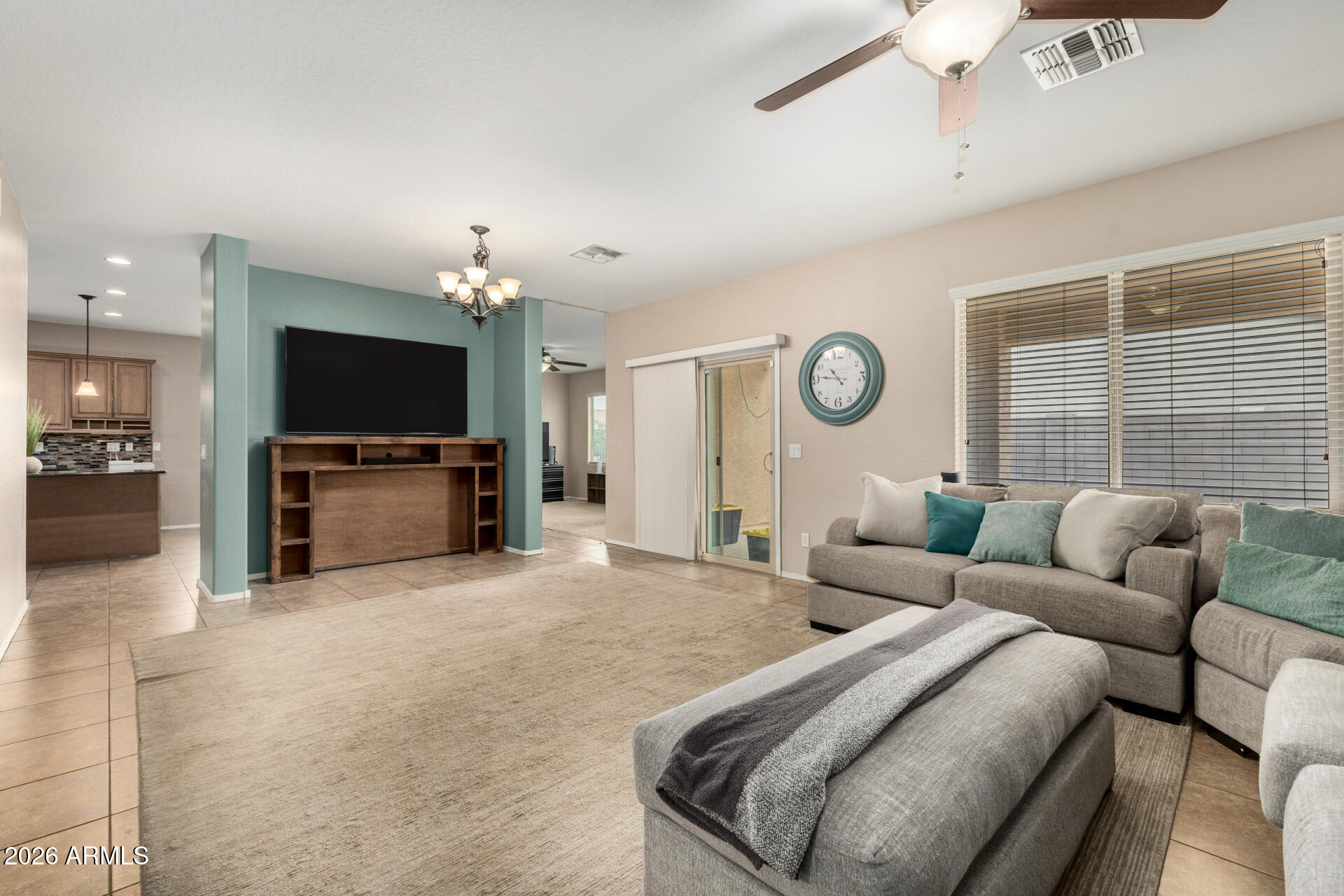 5718 West Pecan Road Laveen, AZ 85339 - Photo 5 of 37 a living room with furniture and a flat screen tv