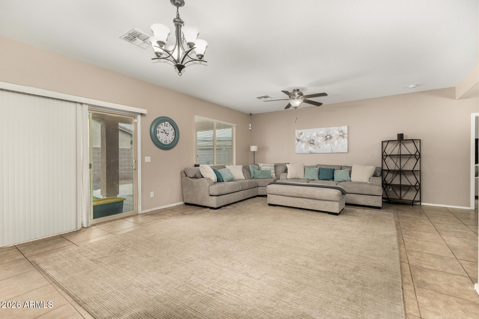 5718 West Pecan Road Laveen, AZ 85339 - Photo 6 of 37 a living room with furniture and a chandelier