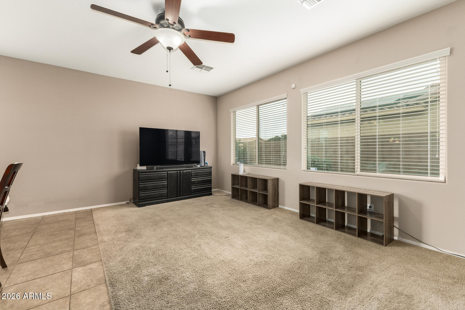5718 West Pecan Road Laveen, AZ 85339 - Photo 8 of 37 a living room with furniture and a flat screen tv