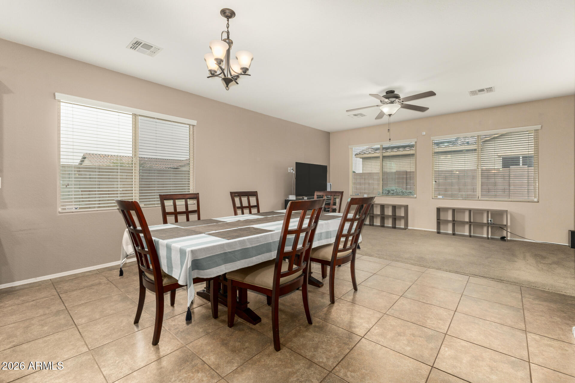 5718 West Pecan Road Laveen, AZ 85339 - Photo 9 of 37 a view of a dining room with furniture and a chandelier
