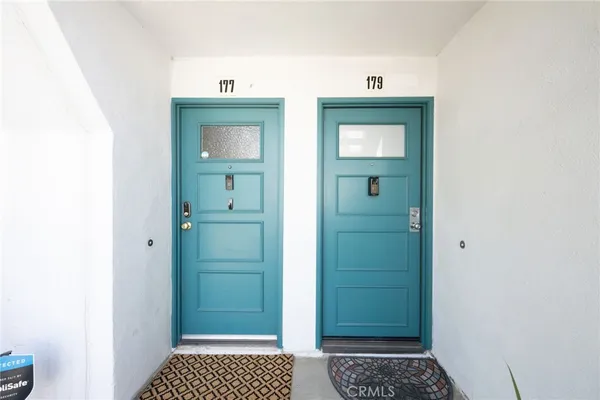 a view of a swimming pool with chairs