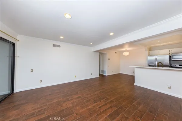 a view of a kitchen with a sink and cabinets