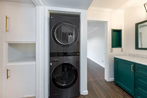 a view of a hallway with washer and dryer