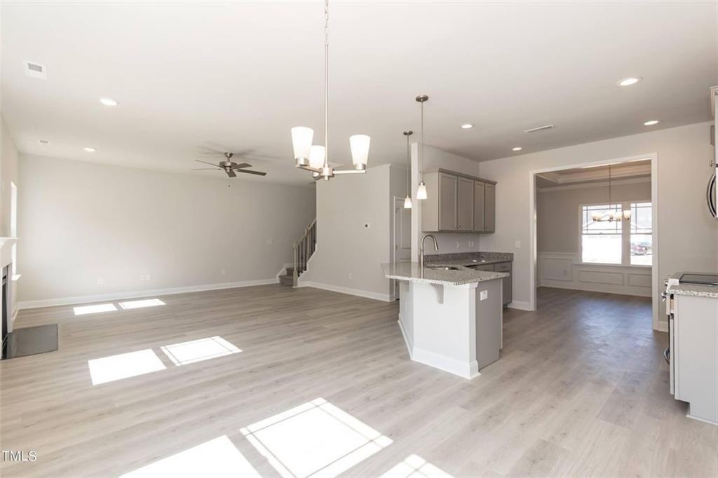 654 Bald Ridge Circle Demorest, GA 30535 - Photo 8 of 22 a view of a kitchen with a sink and dishwasher a stove top oven with wooden floor