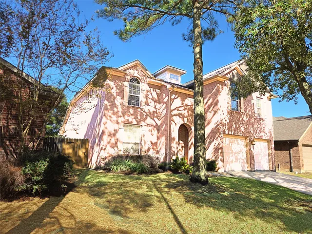 a view of a livingroom with a fireplace and window