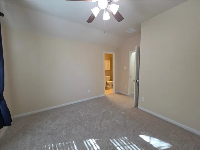 an empty room with a bathroom