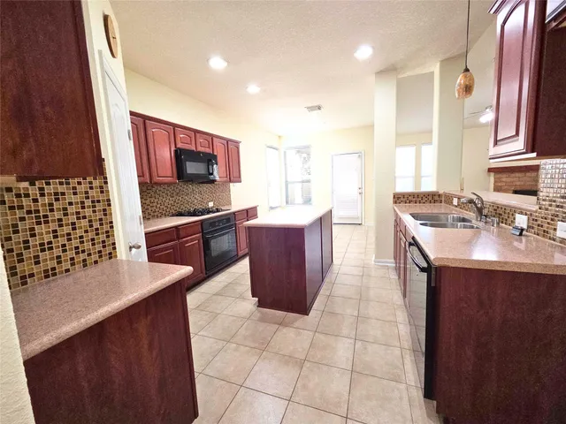 a bathroom with a shower a bath tub and a shower