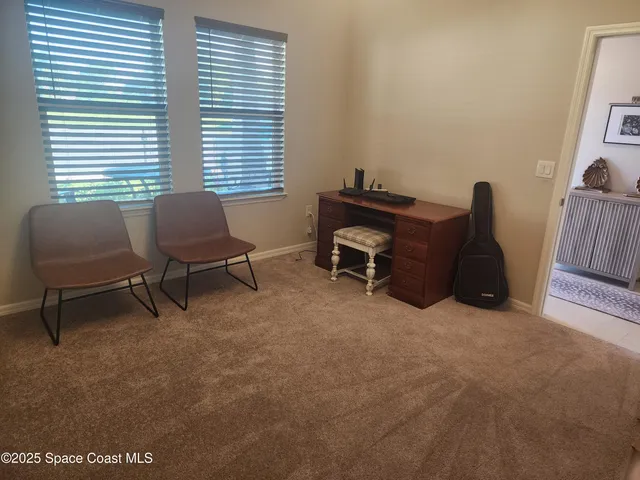 a workspace with furniture and a window