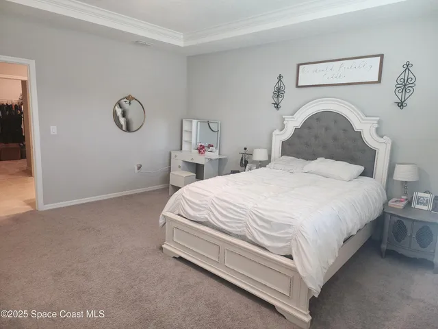 a bedroom with a bed and a closet