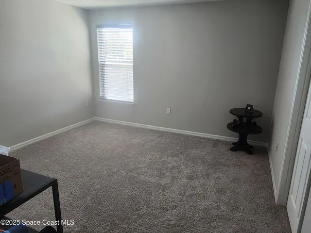 a bedroom with a bed and a closet