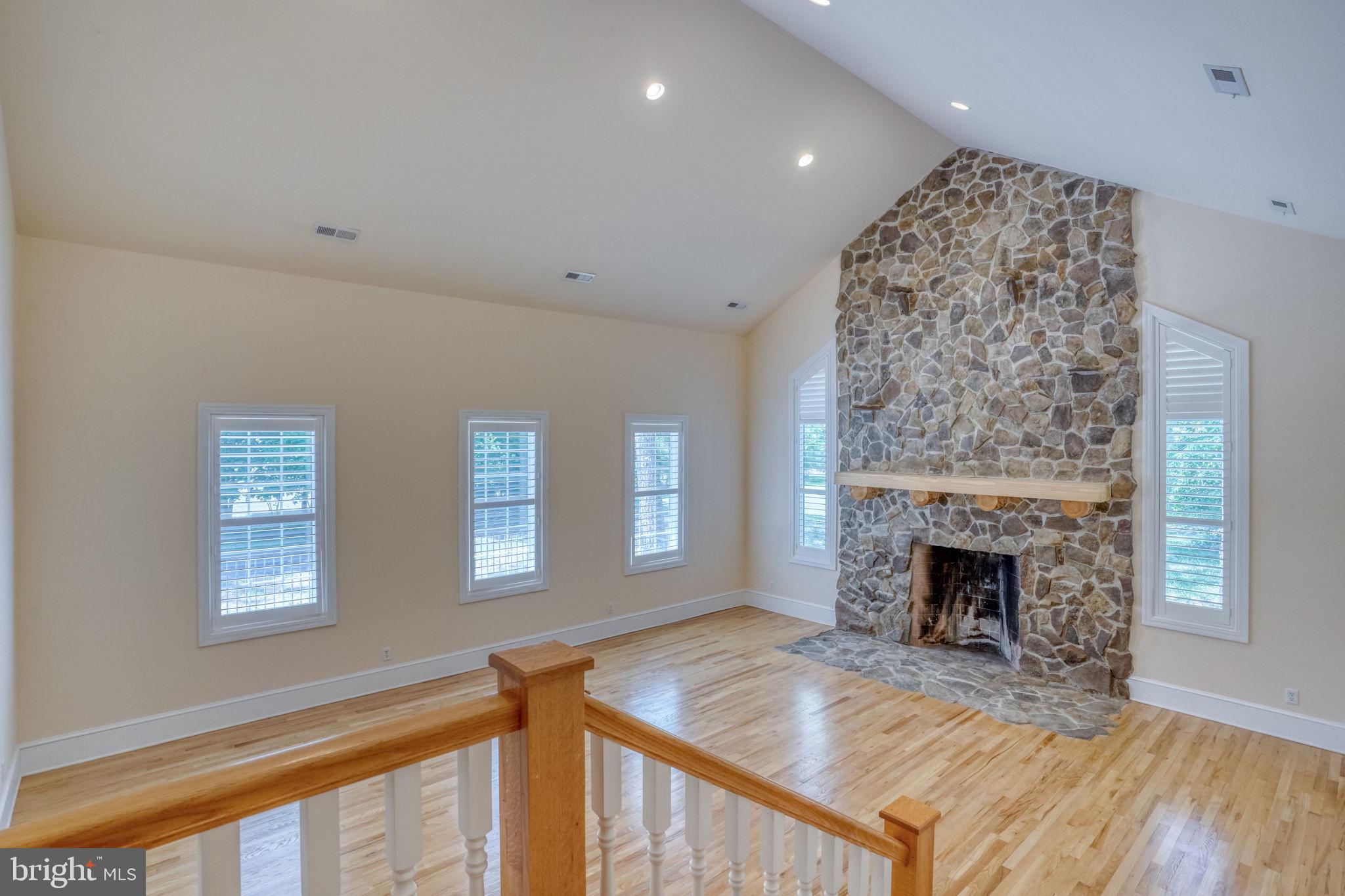 20064 Shingle Point Road Georgetown, DE 19947 - Photo 28 of 77 Great room with stone fireplace