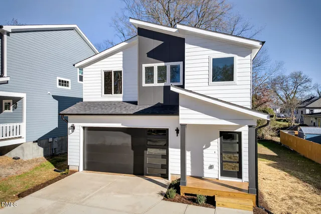 a view of entryway with wooden floor and stairs