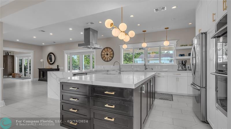 8585 Ranch Road Parkland, FL 33067 - Photo 15 of 69 a kitchen with a sink a counter space appliances and cabinets