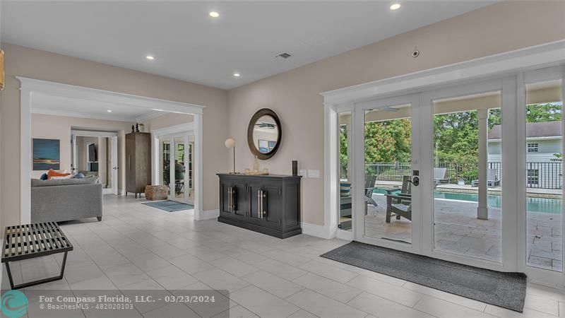 8585 Ranch Road Parkland, FL 33067 - Photo 19 of 69 a living room with furniture a fireplace and a large window