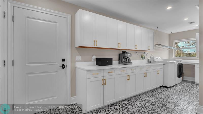 8585 Ranch Road Parkland, FL 33067 - Photo 21 of 69 a kitchen with cabinets appliances a sink and a window