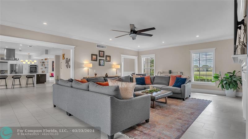 8585 Ranch Road Parkland, FL 33067 - Photo 24 of 69 a living room with furniture and a large window