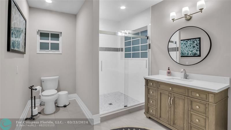 8585 Ranch Road Parkland, FL 33067 - Photo 27 of 69 a bathroom with a toilet a sink and a mirror