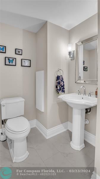 8585 Ranch Road Parkland, FL 33067 - Photo 29 of 69 a bathroom with a sink toilet and a mirror