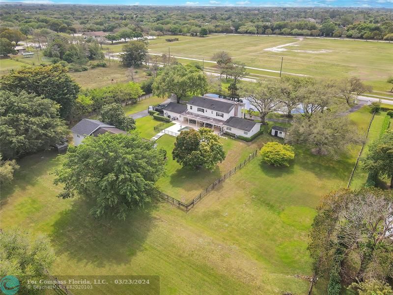 8585 Ranch Road Parkland, FL 33067 - Photo 3 of 69 a view of a lake with a mountain