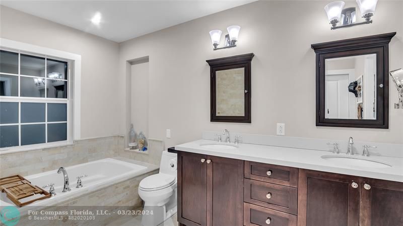 8585 Ranch Road Parkland, FL 33067 - Photo 34 of 69 a bathroom with a double vanity sink and a bathtub