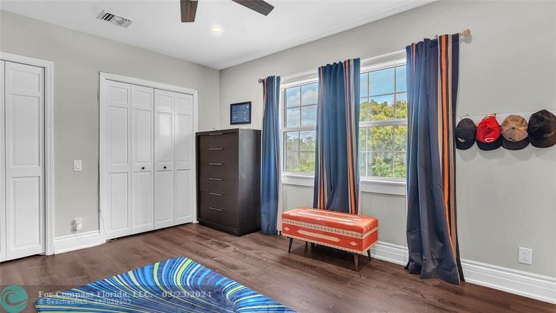 8585 Ranch Road Parkland, FL 33067 - Photo 41 of 69 a bedroom with a bed and a window