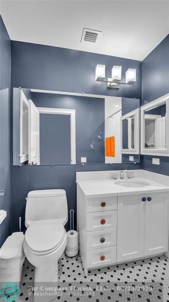 8585 Ranch Road Parkland, FL 33067 - Photo 43 of 69 a bathroom with a sink a toilet and a mirror