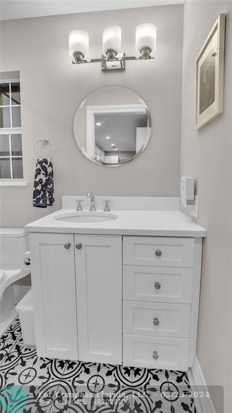 8585 Ranch Road Parkland, FL 33067 - Photo 44 of 69 a bathroom with a sink a vanity and a mirror