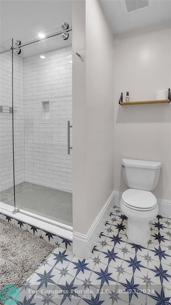 8585 Ranch Road Parkland, FL 33067 - Photo 45 of 69 a bathroom with a toilet and a shower