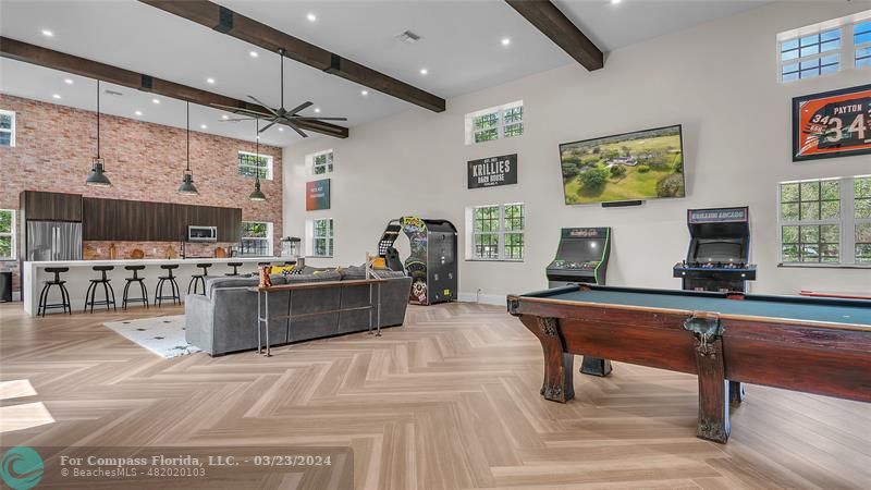 8585 Ranch Road Parkland, FL 33067 - Photo 52 of 69 a room with stainless steel appliances kitchen island granite countertop furniture and a view of living room