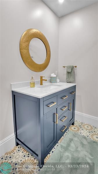 8585 Ranch Road Parkland, FL 33067 - Photo 57 of 69 a bathroom with a sink mirror and vanity