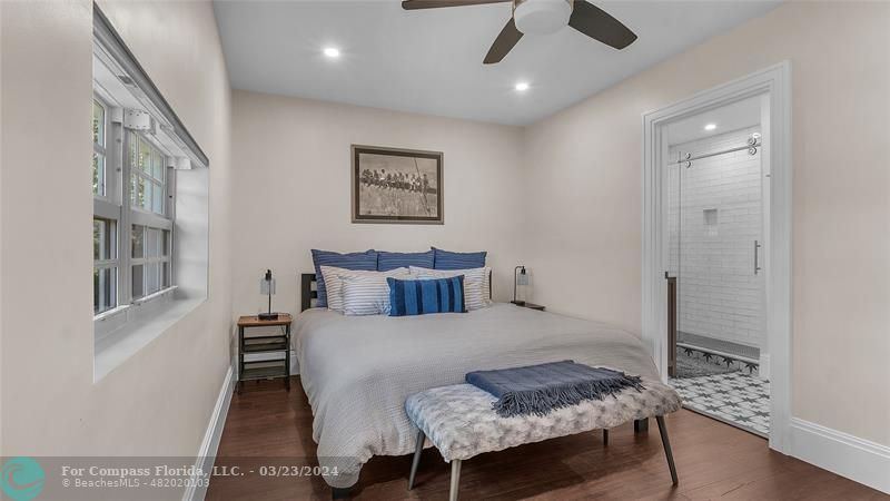 8585 Ranch Road Parkland, FL 33067 - Photo 59 of 69 a bedroom with a bed and a chandelier