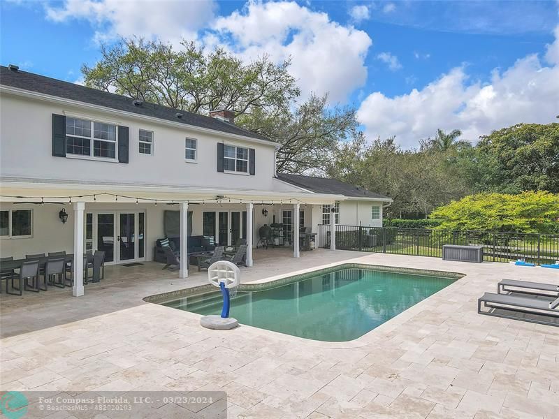8585 Ranch Road Parkland, FL 33067 - Photo 62 of 69 a view of a house with pool and chairs