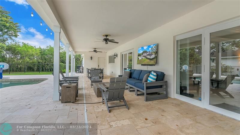 8585 Ranch Road Parkland, FL 33067 - Photo 63 of 69 a living room with furniture and a flat screen tv