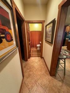 215 70l Rd Junction Junction, TX 76849 - Photo 17 of 43 a view of a hallway with wooden floor and furniture