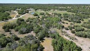 215 70l Rd Junction Junction, TX 76849 - Photo 26 of 43 a view of a forest with a street