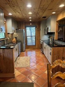 215 70l Rd Junction Junction, TX 76849 - Photo 8 of 43 a kitchen with stainless steel appliances granite countertop a stove a sink and a microwave
