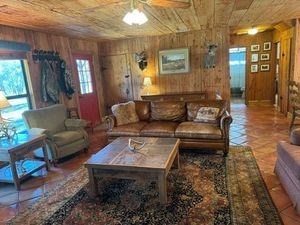 215 70l Rd Junction Junction, TX 76849 - Photo 10 of 43 a living room with furniture and a rug
