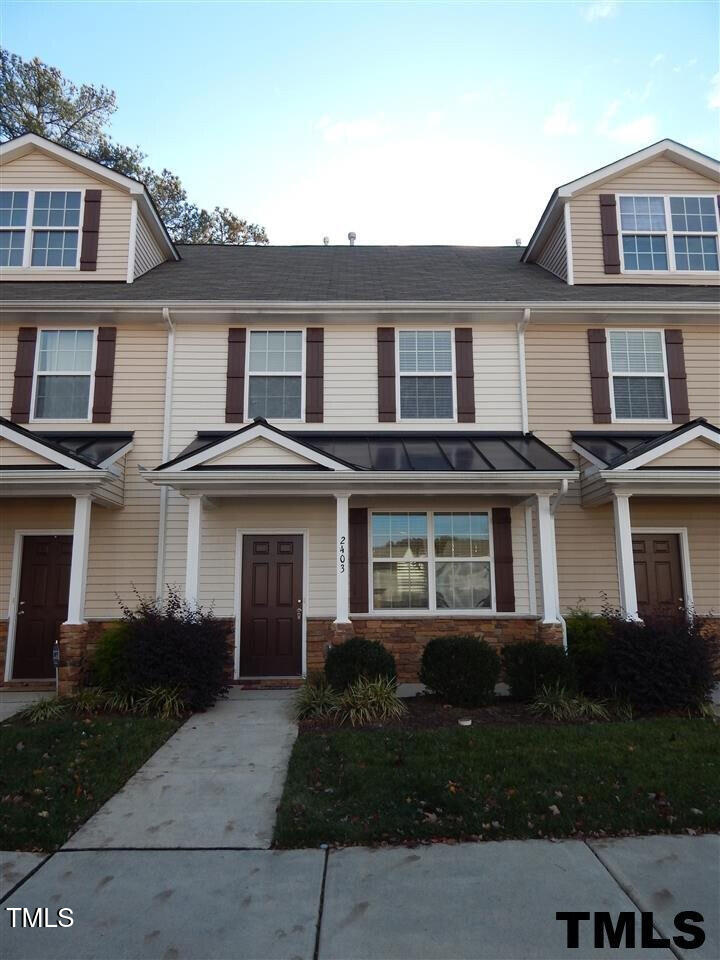 2403 Savior Street Raleigh, NC 27610 - Photo 1 of 21 a front view of a house with a yard and trees