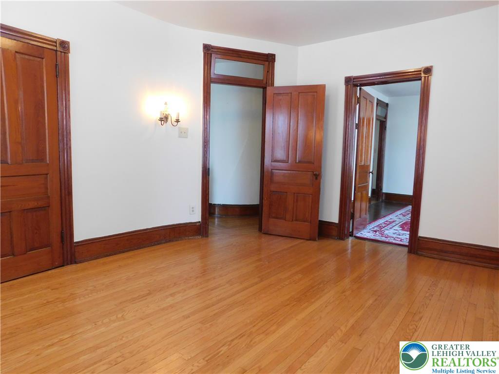 300 South 9th Street, Unit 2/UPSTAIRS Lehighton, PA 18235 - Photo 15 of 19 an empty room with wooden floor and closet
