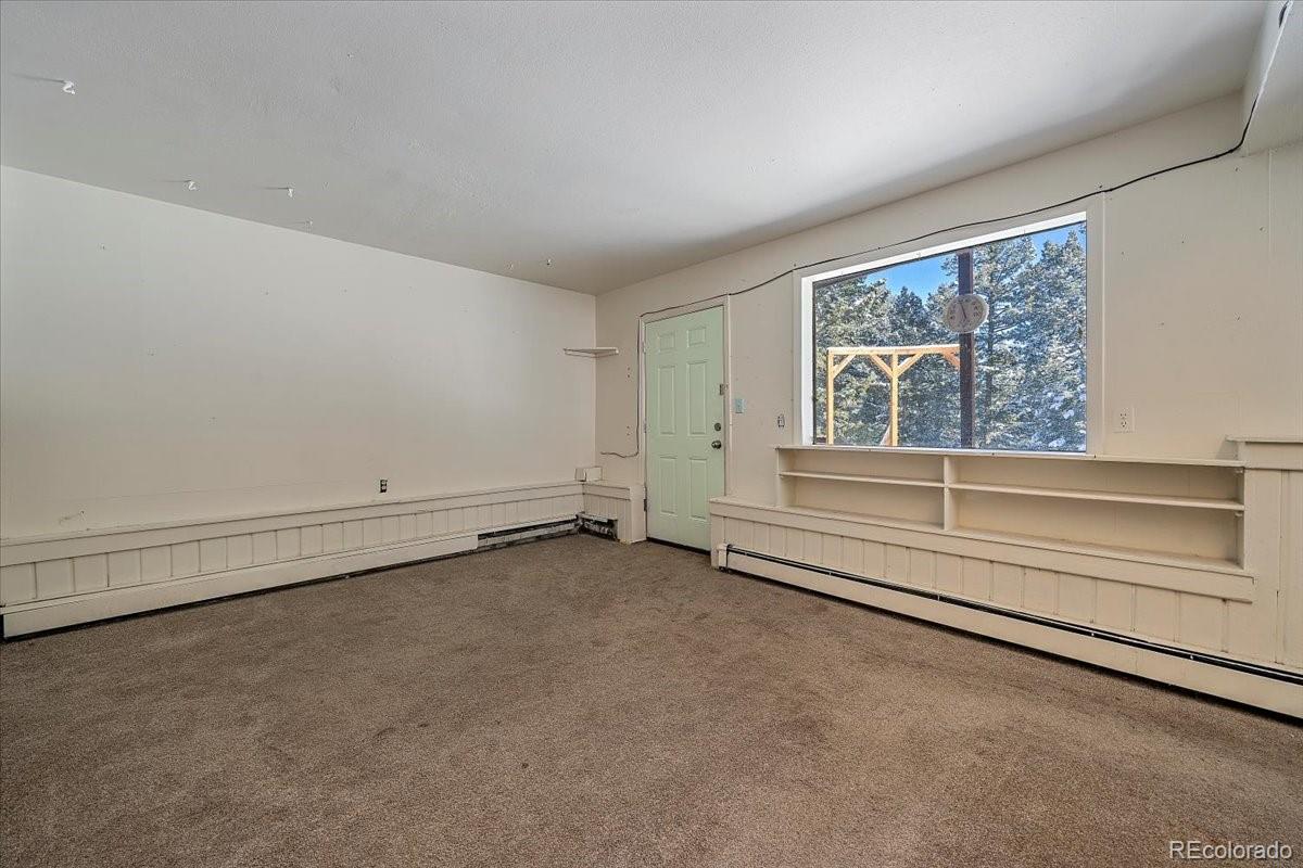 4551 Hilltop Road Evergreen, CO 80439 - Photo 16 of 30 an empty room with a empty space